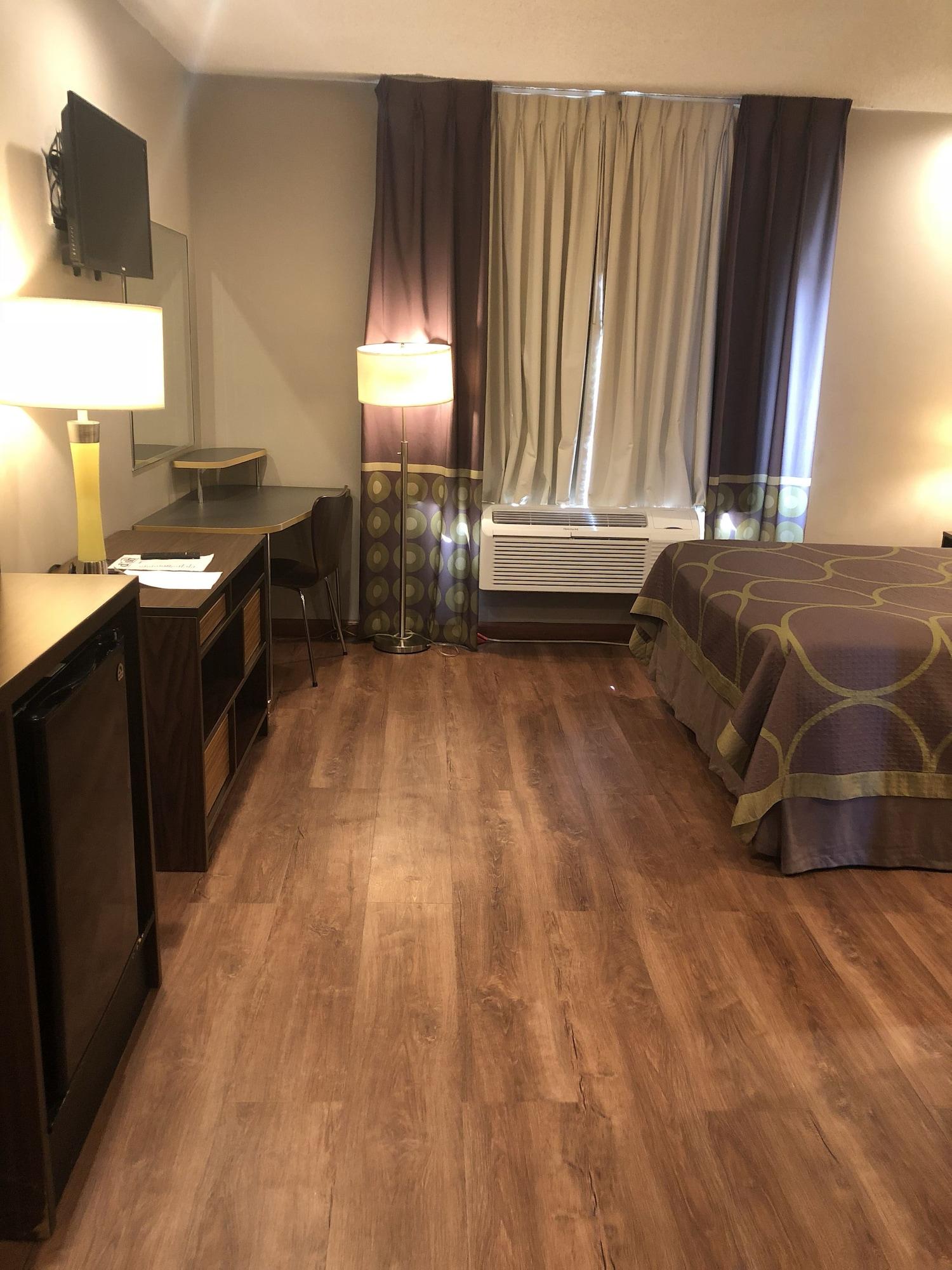 Super 8 By Wyndham Jamaica North Conduit Hotel New York Bagian luar foto